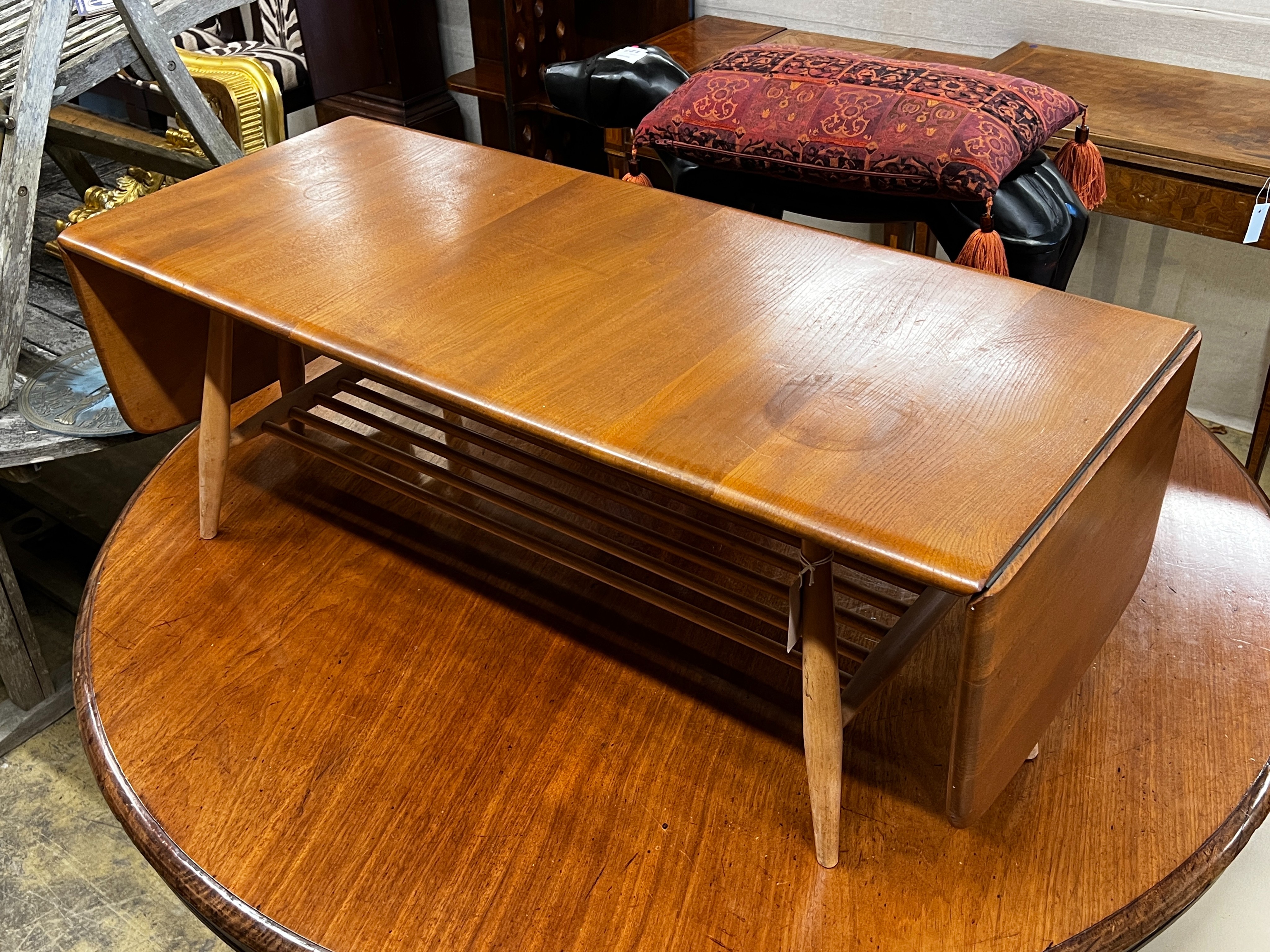 An Ercol elm drop flap coffee table, length 106cm, depth 45cm, height 36cm
